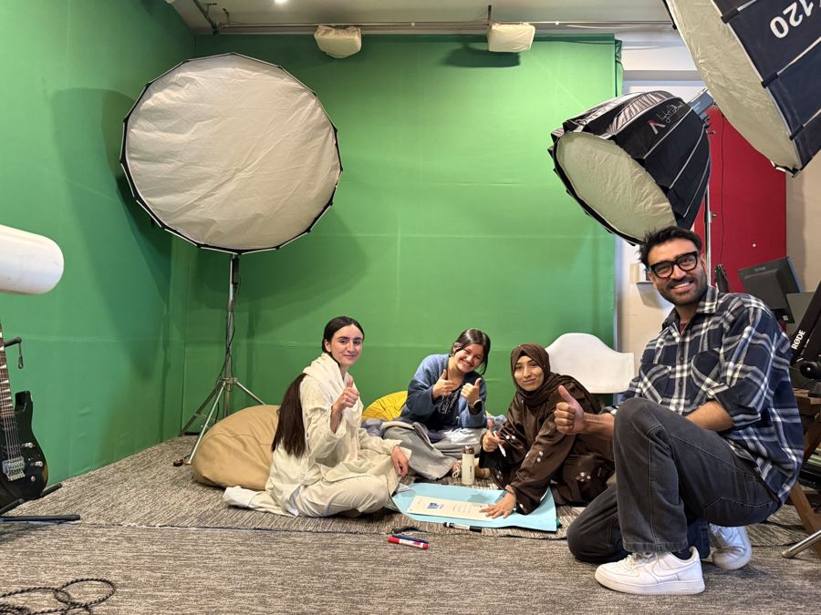 Trainees and a trainer in the studio